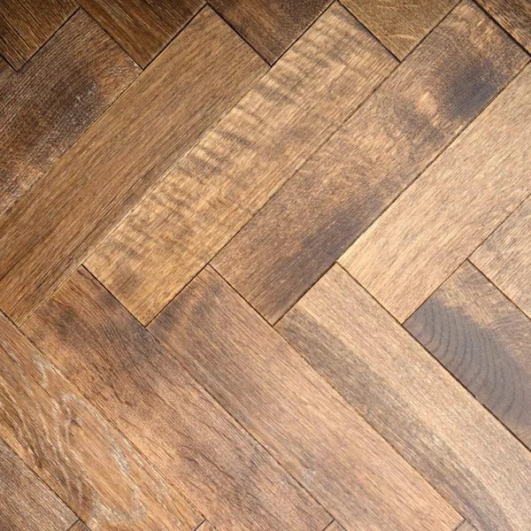 Engineered smoked herringbone flooring close up